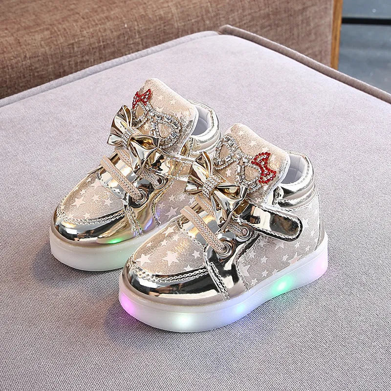 Children's LED trainers with magic button and illuminated soles in golden, pink or silvery colours