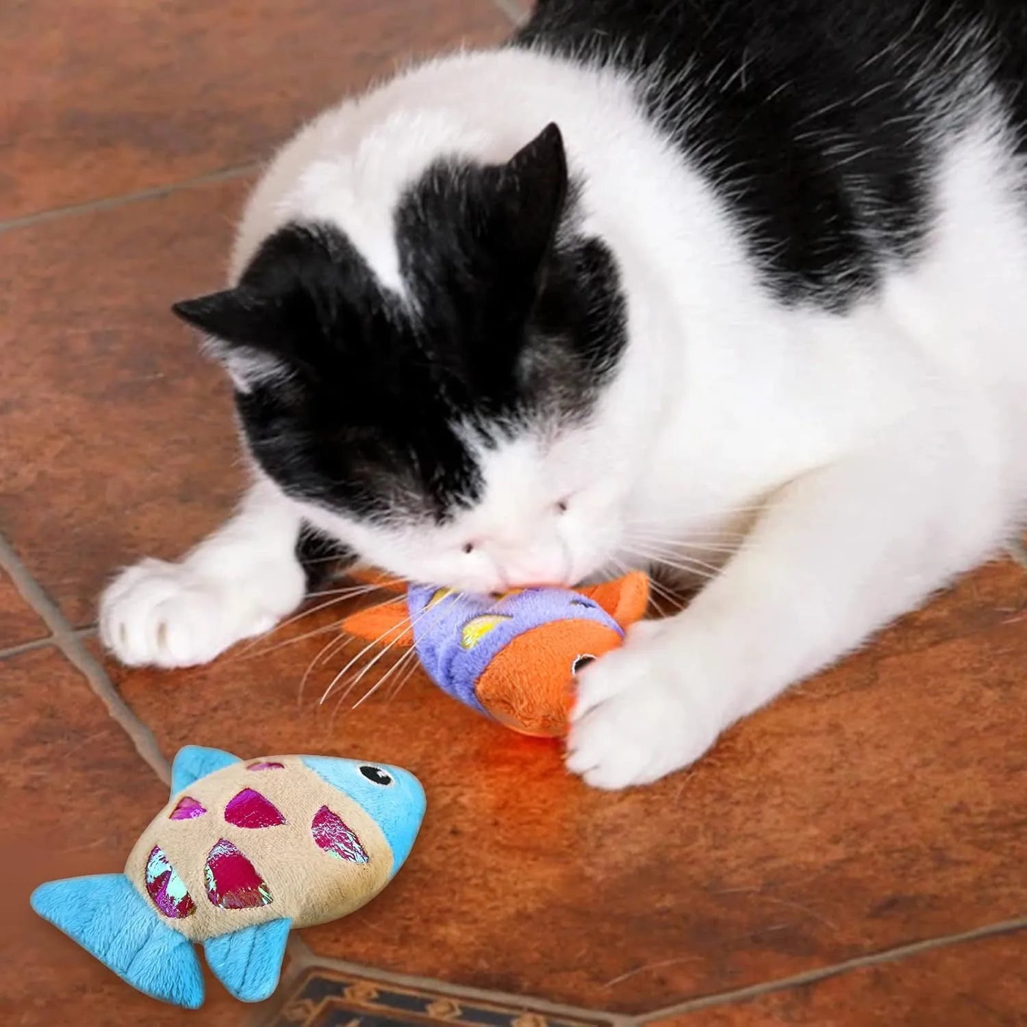 Blue, orange and pink fish-shaped cat toys with plush exterior and crinkle paper elements