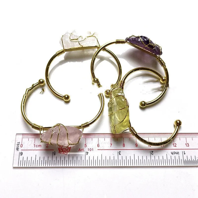 Natural crystal rough stone bracelet with gold winding geometric design showing colour mixing finish