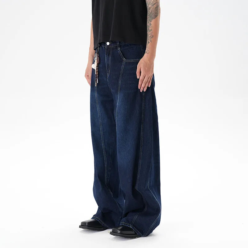 Dark blue women's wide-leg denim jeans with distressed detailing on the legs.