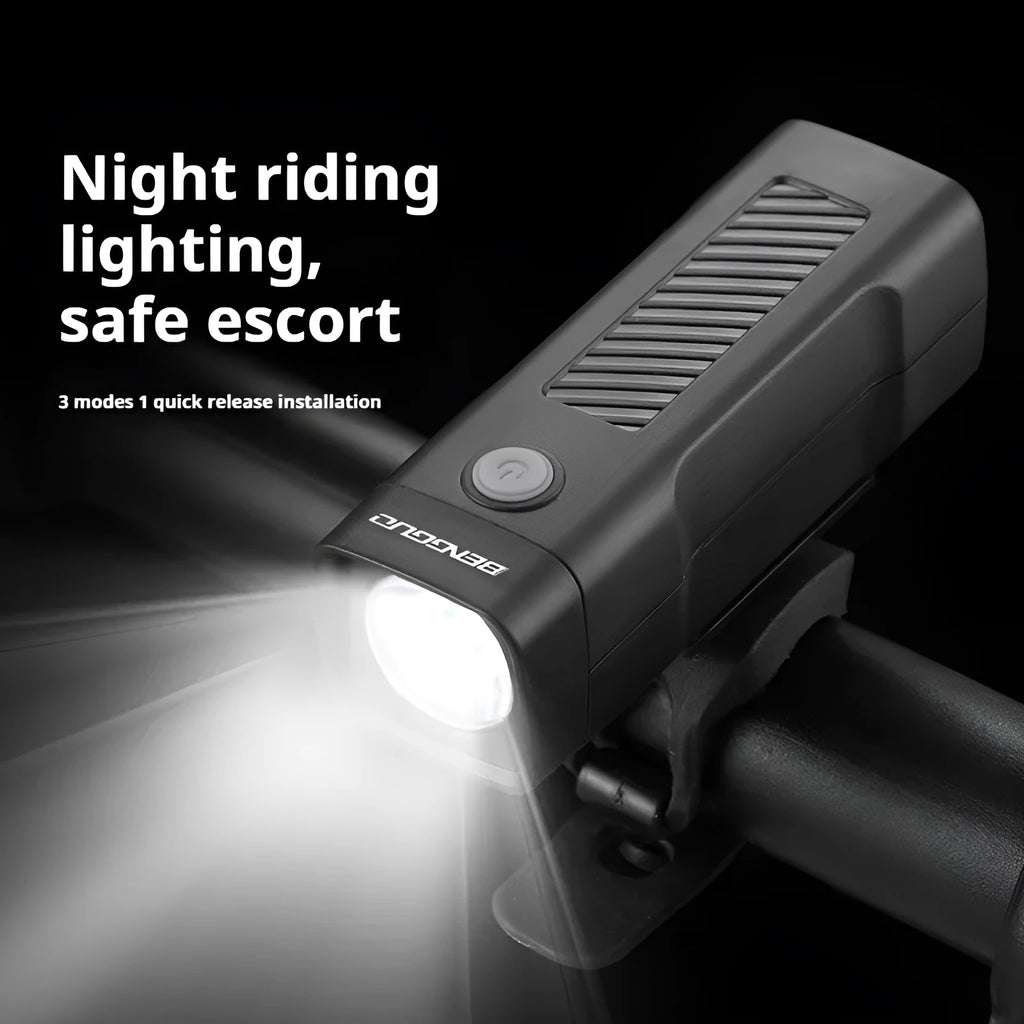 Black USB rechargeable bicycle headlight with quick-release strap mount on handlebars.