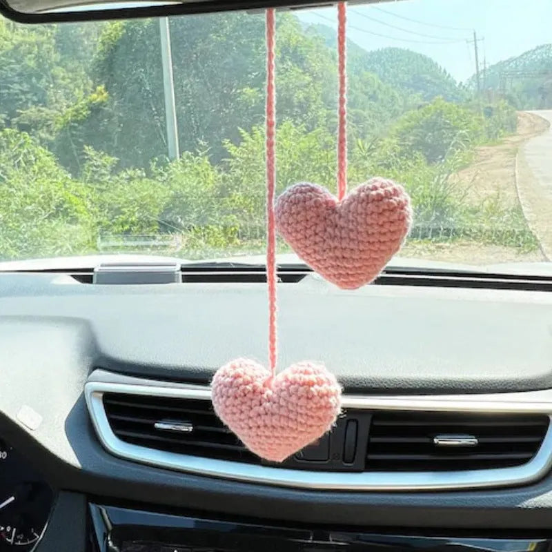 Green and white knitted wool car plant decoration with 8cm base and hanging rope.