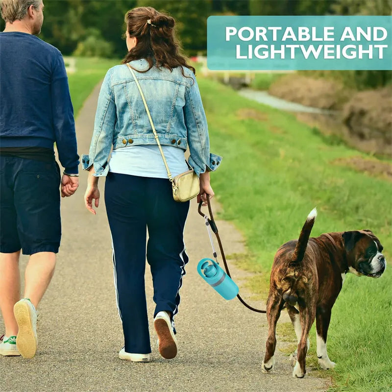 Blue portable dog pooper scooper with claw mechanism and built-in bag dispenser