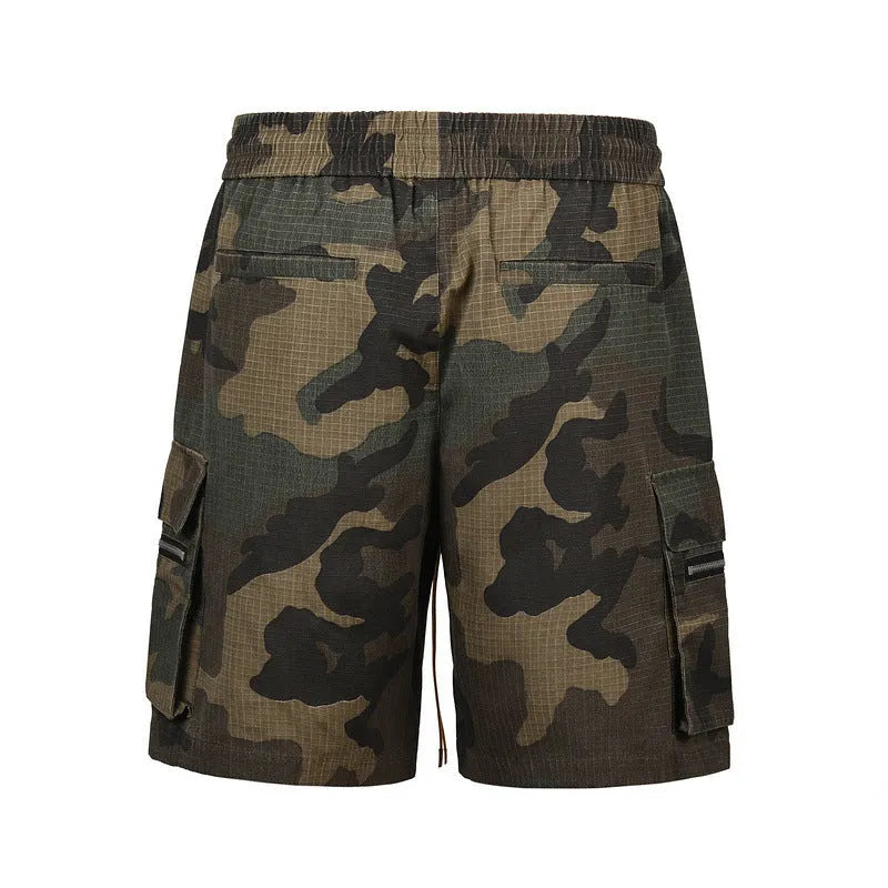 Men's green camouflage cotton work shorts with a loose fit, shown on a mannequin