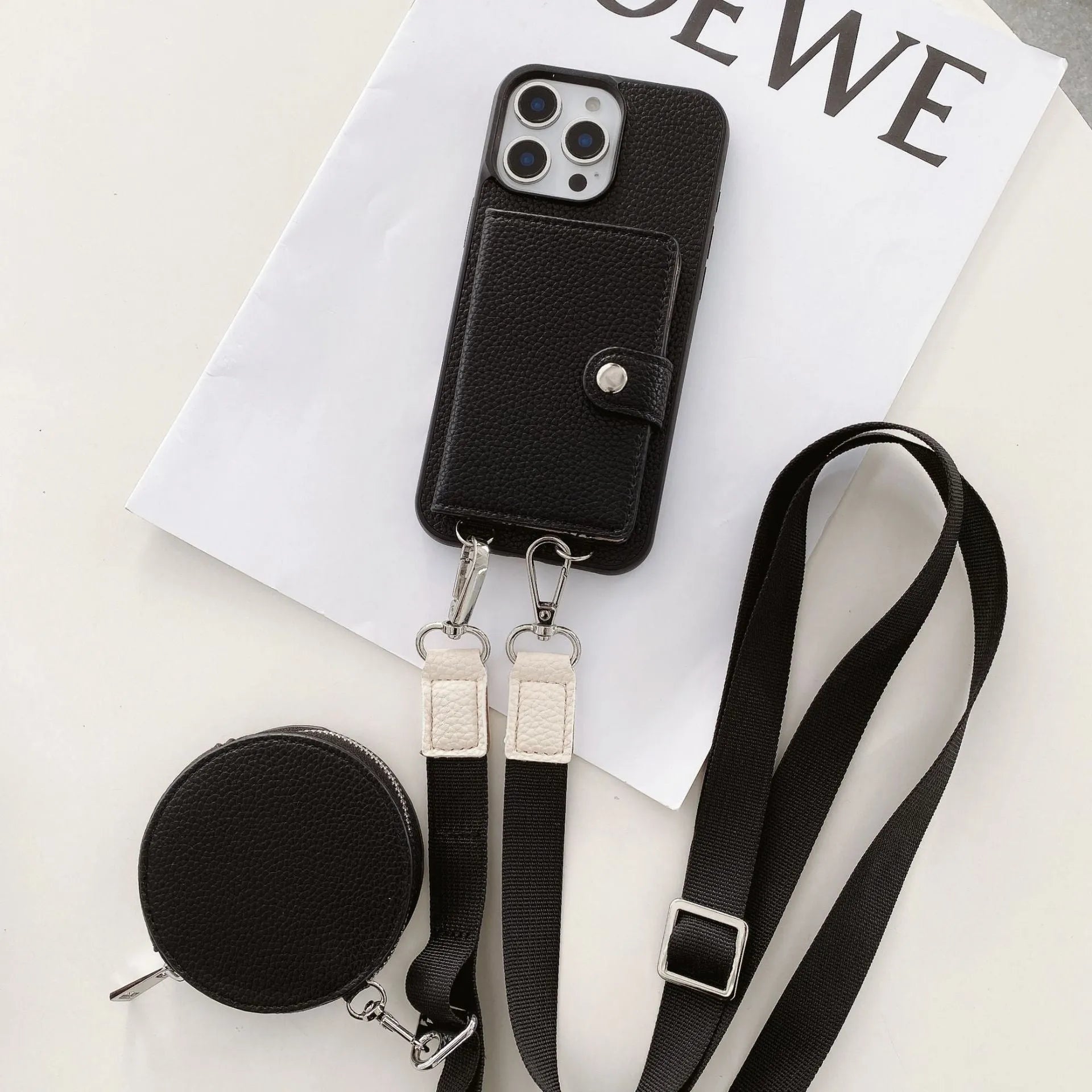 PC leather phone case with card holder slot and lanyard loop for Apple iPhone, shown in black.