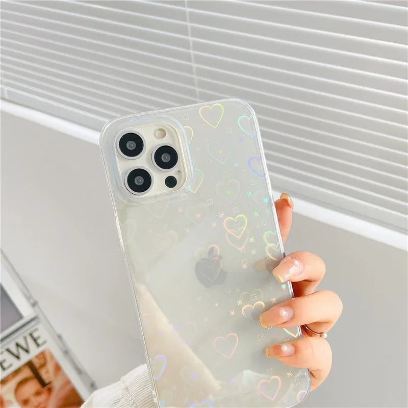 Transparent silicone iPhone case with laser love design, shown on a phone.
