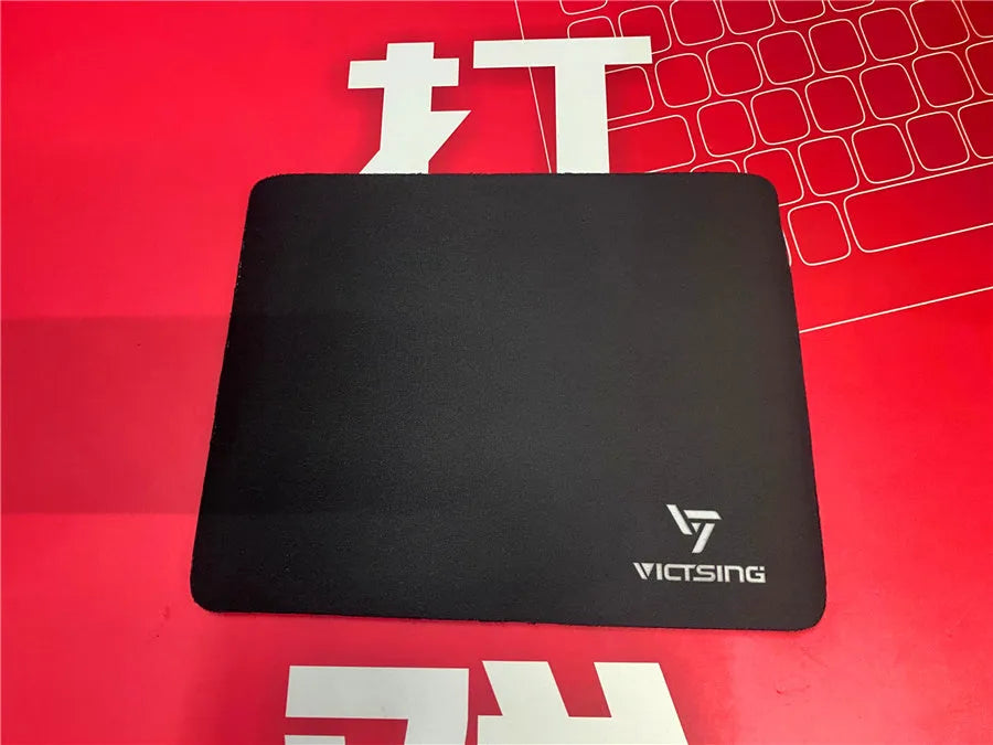 Black rough grain textured gaming mouse pad with 5mm thick rubber base measuring 270mm by 220mm