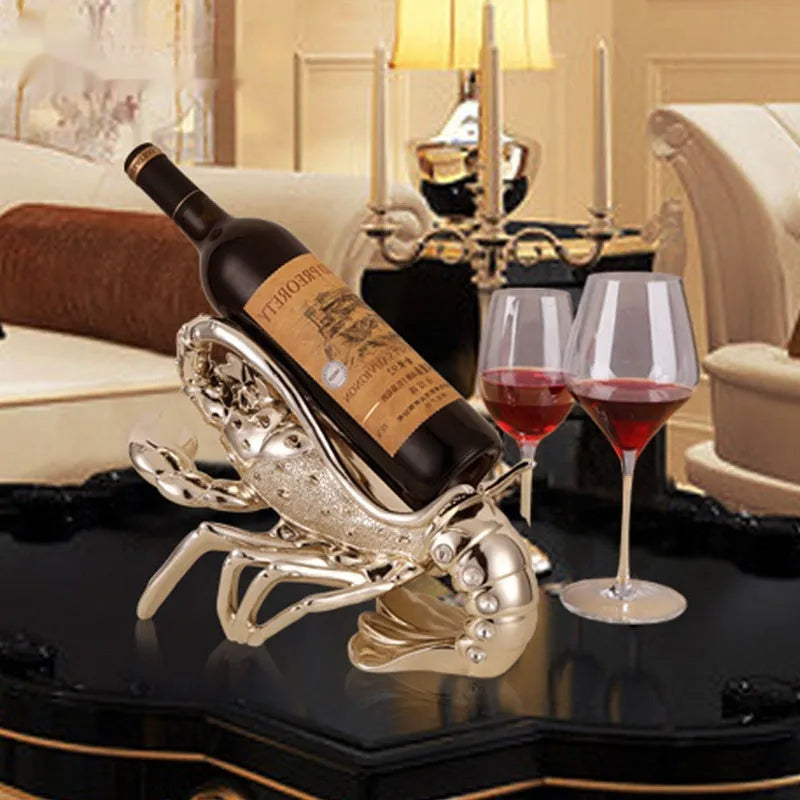 Lobster-shaped wine rack ornament in rose gold holding a wine bottle