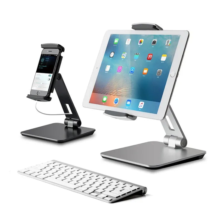 Silver foldable tablet stand showing 360-degree rotation mechanism with silicone anti-slip pads