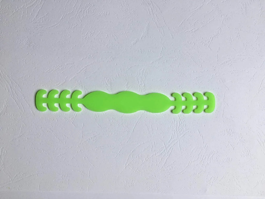 Eight silicone protective buckles in different colours for cable organisation