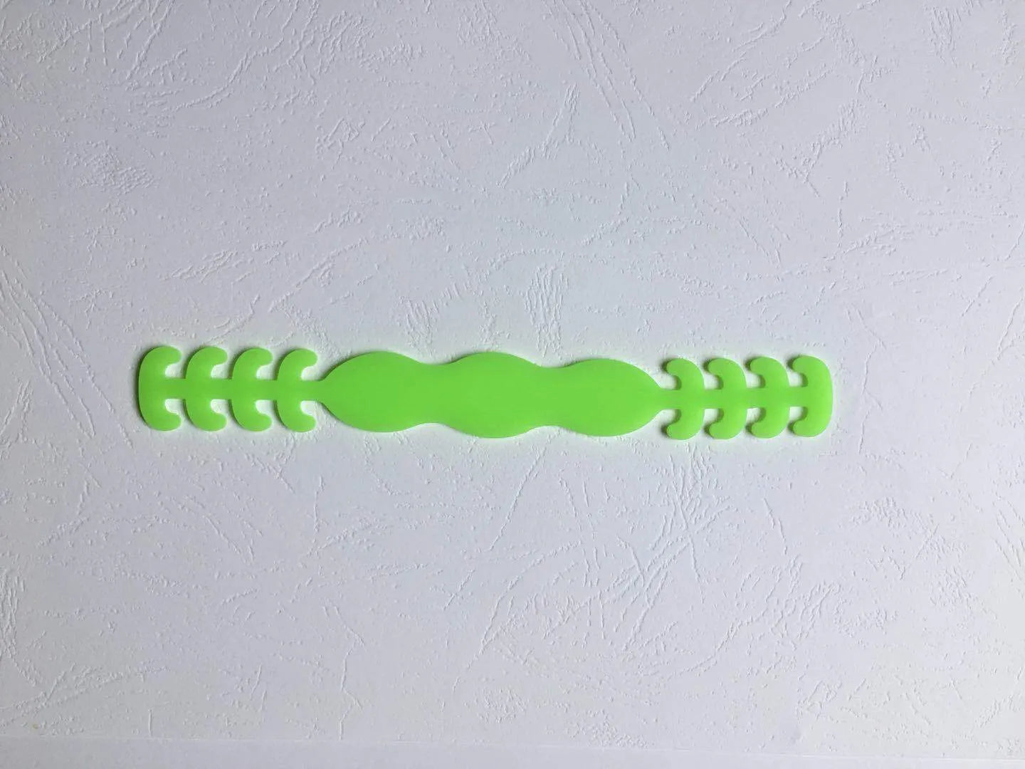 Eight silicone protective buckles in different colours for cable organisation