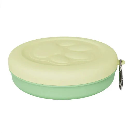 Portable outdoor dog feeding bowl shown in light pink and green colour options.