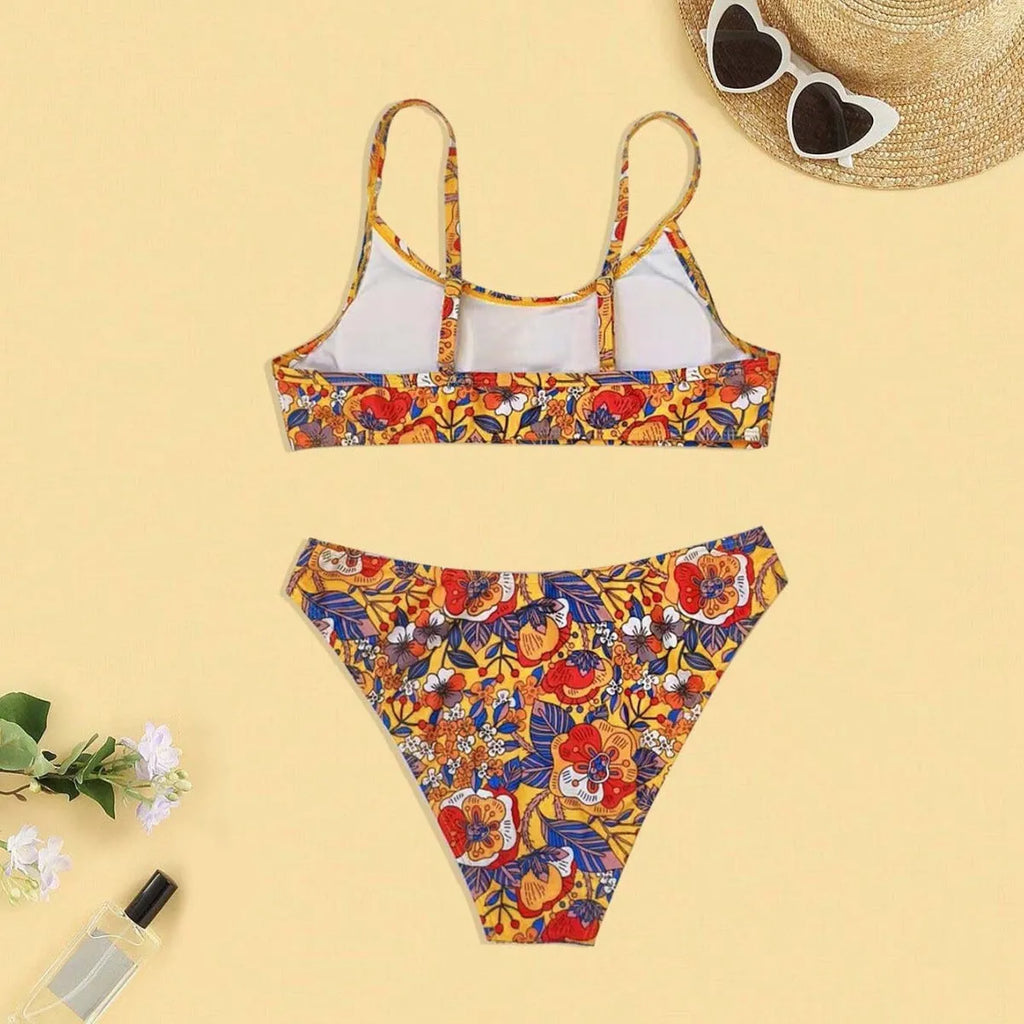 Plus size women's floral print bikini set with strapped design and brief style
