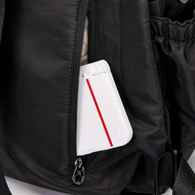 Large outdoor nylon backpack in black, shown with dimensions and sandwich pocket detail.
