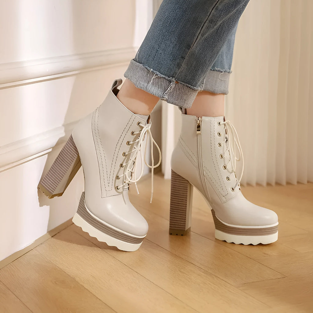 Women's black waterproof platform boots with chunky heel, cowhide upper, and side zip closure