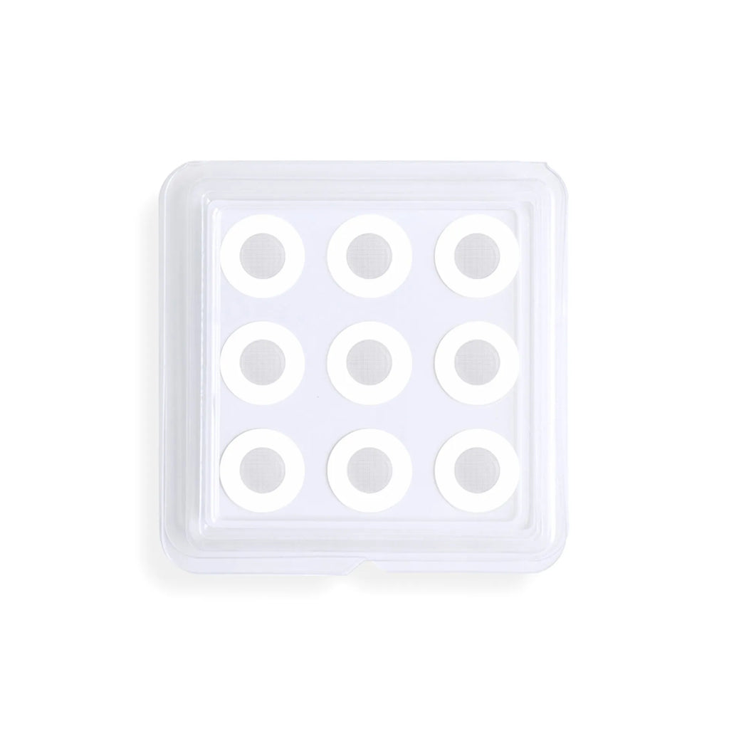 Transparent hydrocolloid acne patch stickers on skin for pimple treatment.