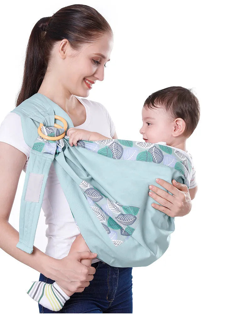 Adjustable baby wrap carrier sling shown in multiple colours, suitable for infants 0-36 months.