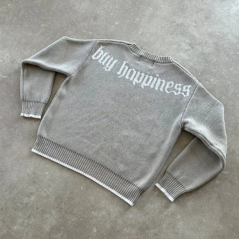 Gray loose-fitting Jacquard knitwear coat with long sleeves on a hanger.