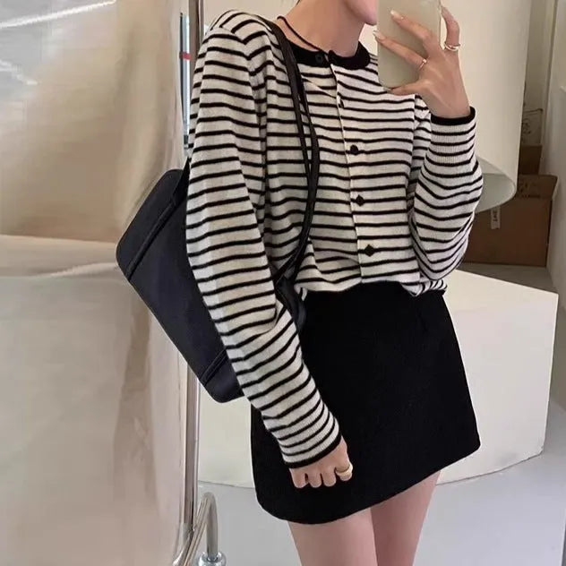 French style striped cardigan sweater coat with slim fit and short length on dark grey background