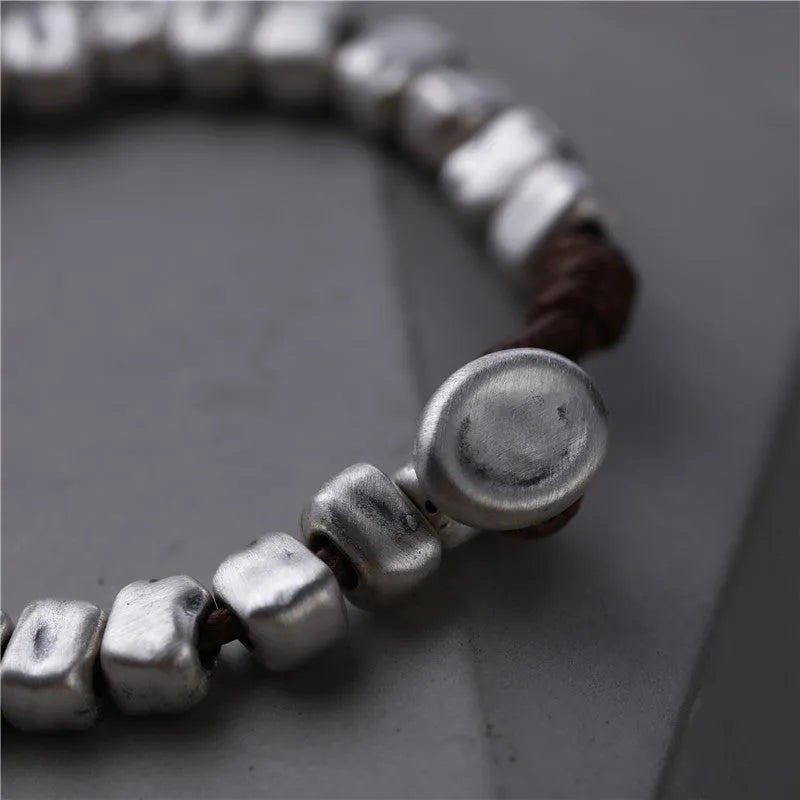 Handmade silver women's bracelet with wooden accents and irregular square design