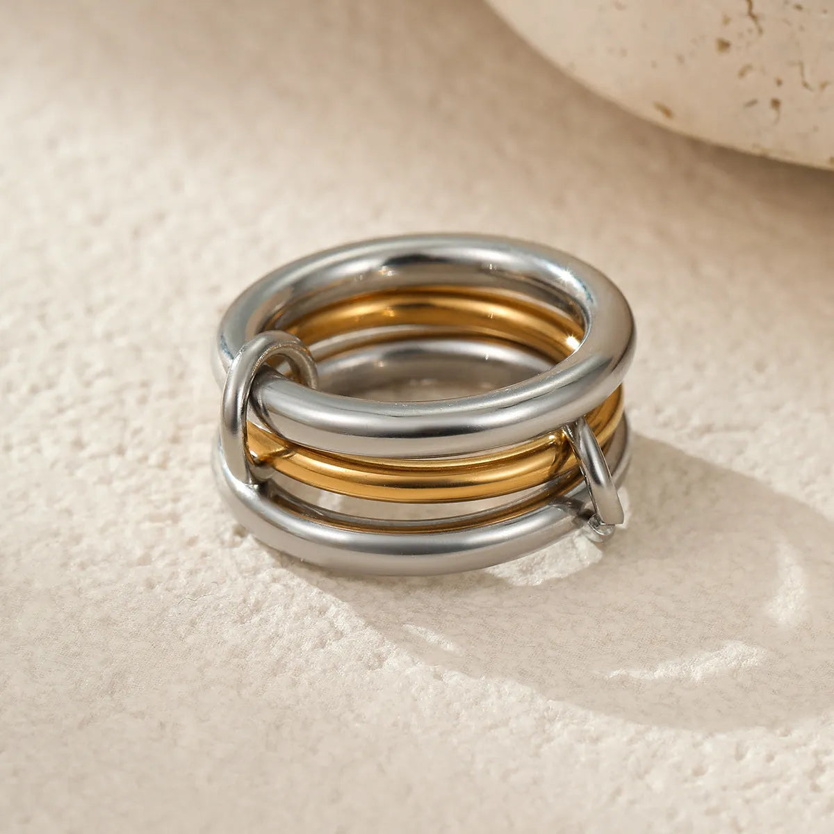Women's gold-plated stainless steel stacked ring set in three colour options with exaggerated design