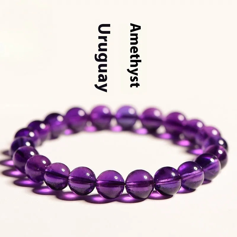 Natural Uruguay amethyst scattered bead bracelet showing purple gemstone beads on a string.