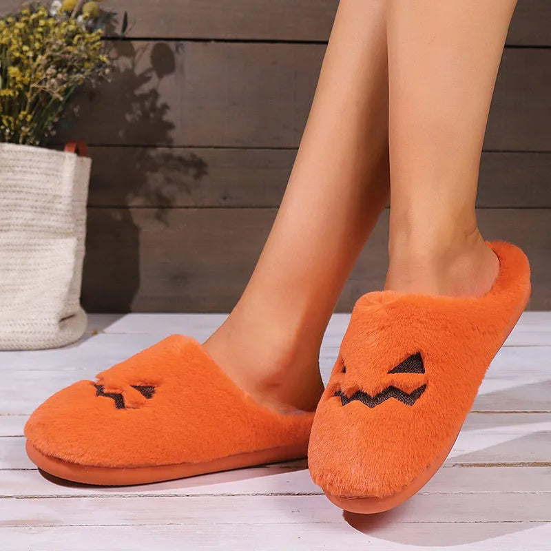 Orange plush Halloween pumpkin slippers with a coral velvet upper and non-slip sole