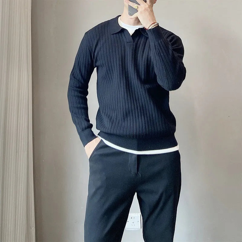 Man wearing a loose striped knitted sweater with a lapel collar in light grey.