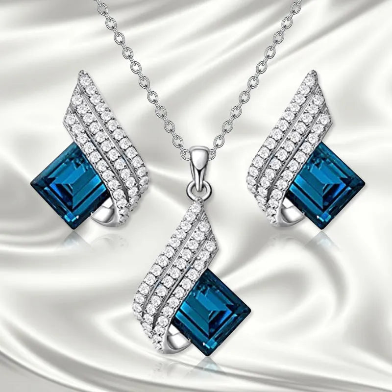 Fashion jewellery set showing alloy pendant necklace with cross chain and matching glass ear studs