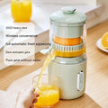 Fresh green wireless portable electric juicer with USB charging cable on a kitchen counter.