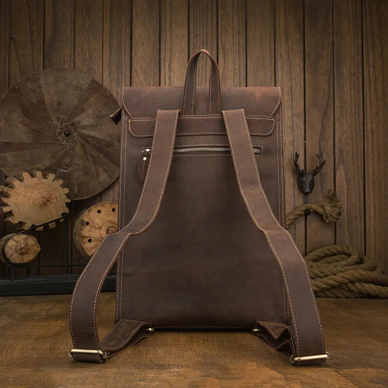 Dark brown genuine leather men's travel bag with shoulder straps and vertical square shape