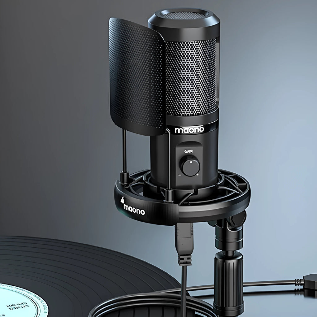 USB recording microphone with shock mount and tripod on a desk for computer or phone dubbing.