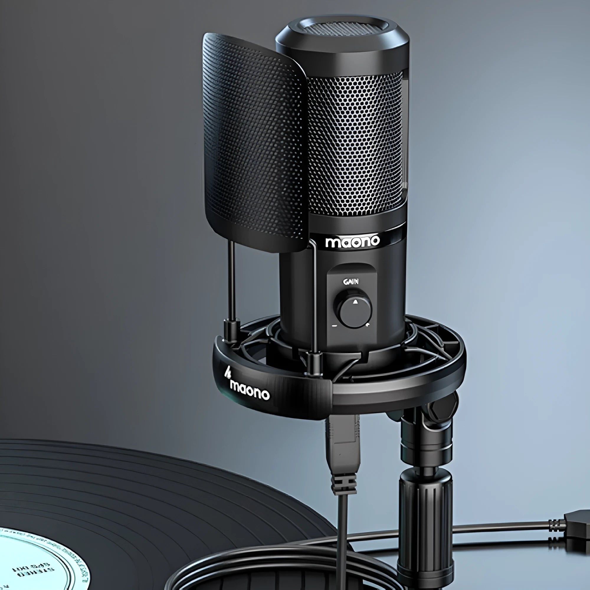 USB recording microphone with shock mount and tripod on a desk for computer or phone dubbing.