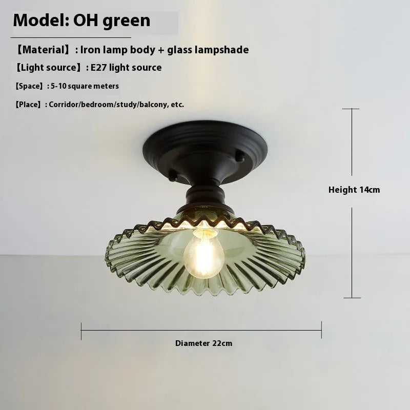 American retro single-head ceiling lamp with clear glass shade showing exposed filament style