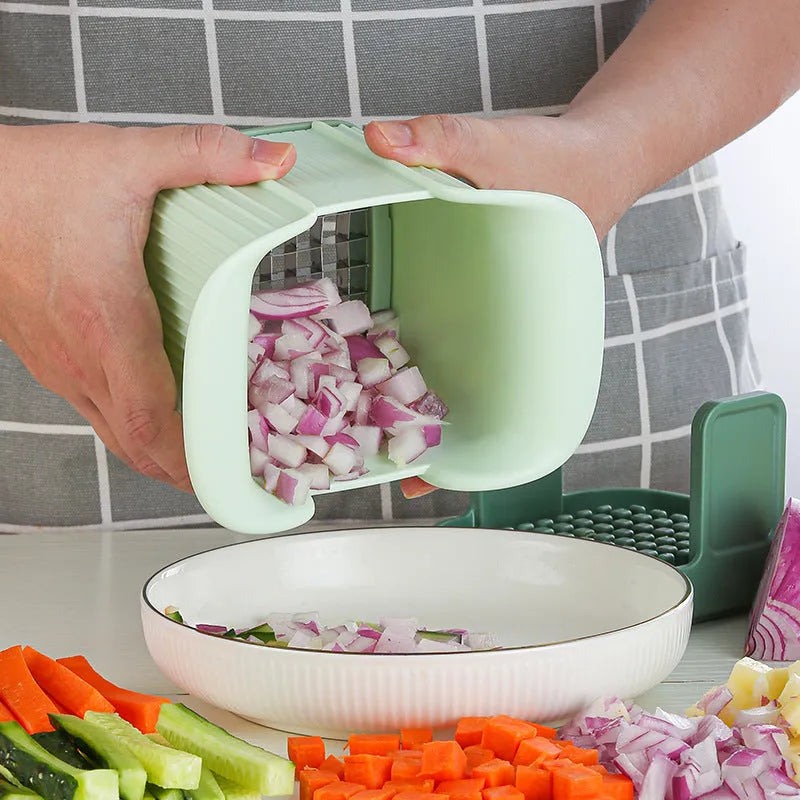 Green handheld multi-functional vegetable chopper with stainless steel blades for onions and potatoes