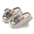 Elephant grey open-toe linen slippers for couples on a plain background, showing sewn sole detail.
