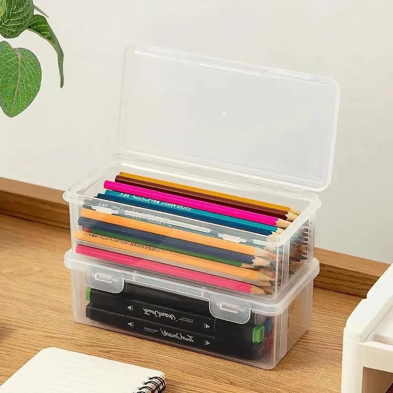 Transparent plastic pencil storage box showing interior space for organising stationery