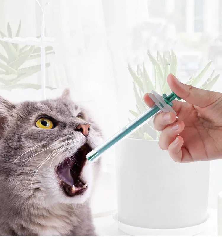 Two soft-tip pet pill shooter syringes for cats and dogs on a white background.
