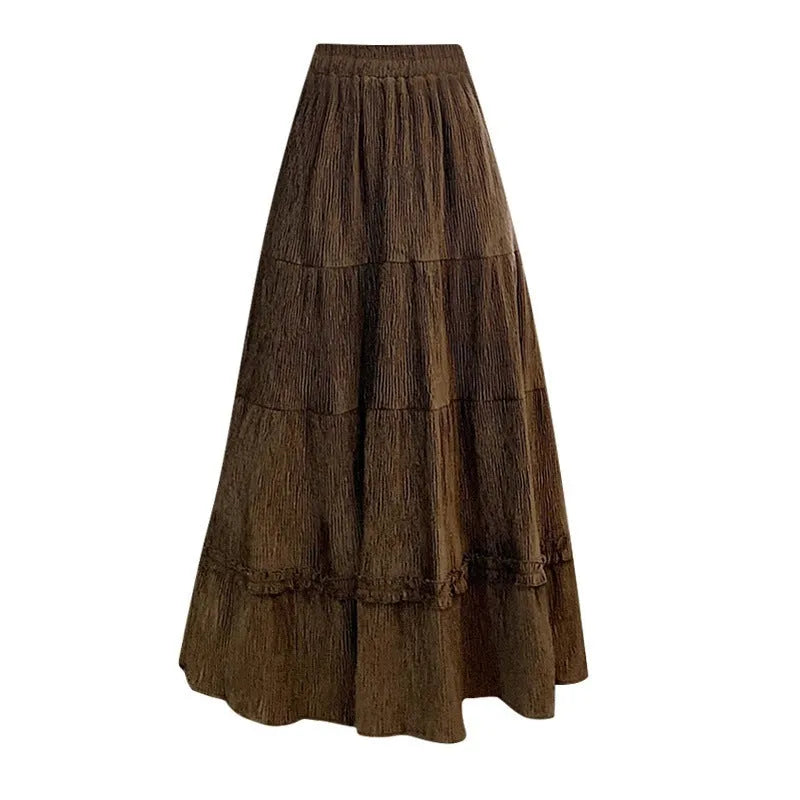 Korean style beige corduroy A-line midi skirt with elastic waistband on a hanger.