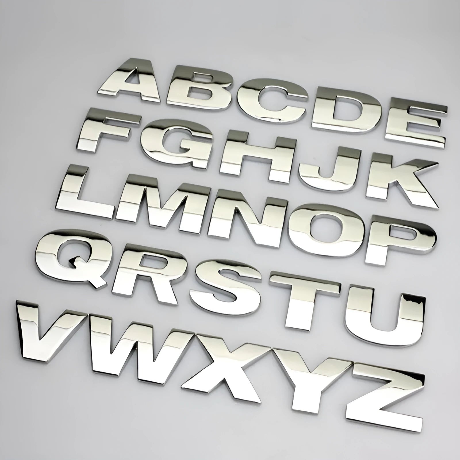 Zinc alloy metal car letter sticker in 3D style, shown in silver finish, approx 2.5cm size.