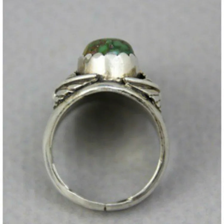 Women's geometric turquoise alloy ring with a retro inlaid design, shown on a finger.