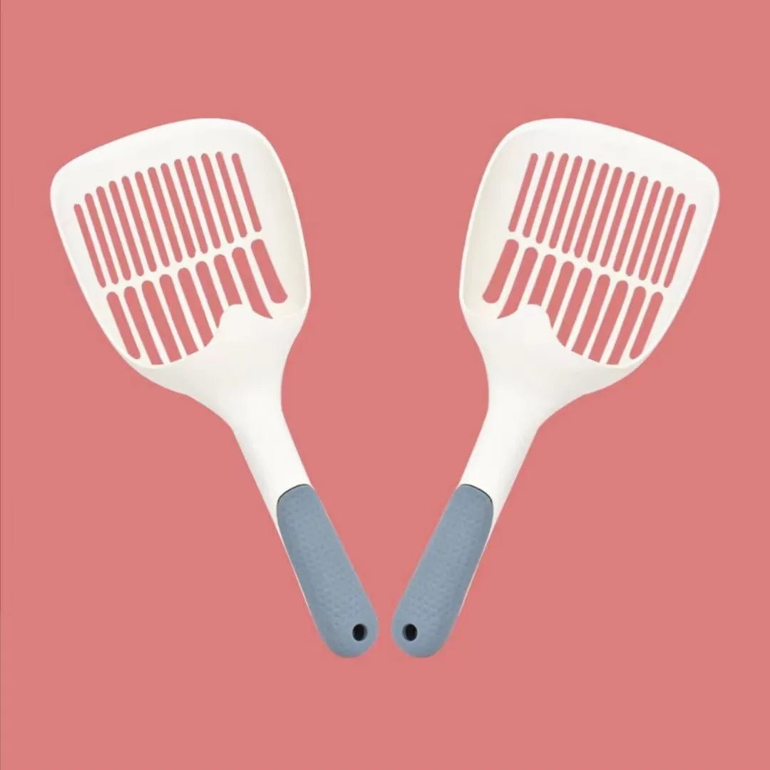 Large white plastic cat litter shovel with angled handle on a grey background.