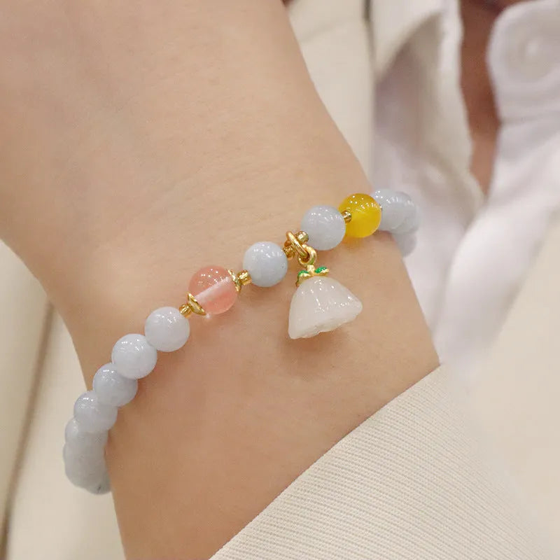 Aquamarine crystal bracelet with gold-plated climbing cat charm for women