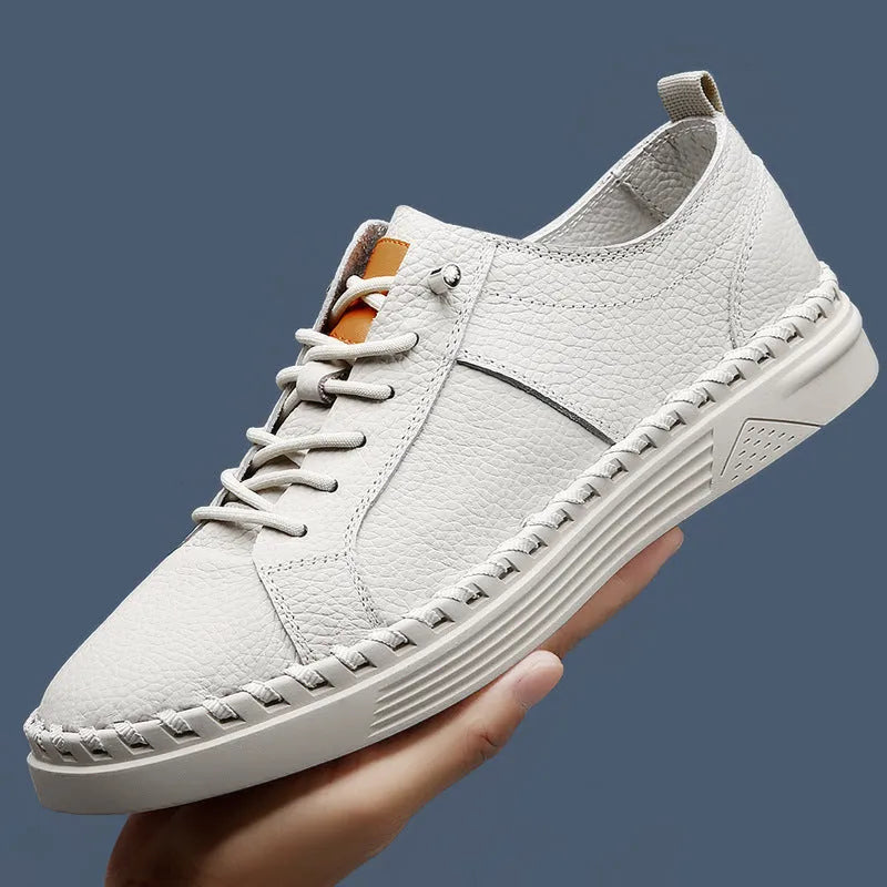 Men's beige and black cowhide leather sneakers with mesh lining and round toe.