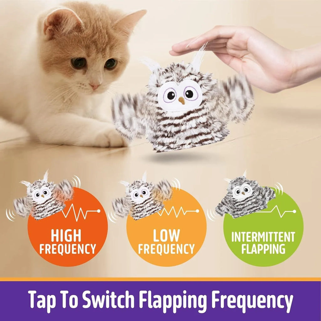 Grey automatic owl cat toy with flapping wings on a floor