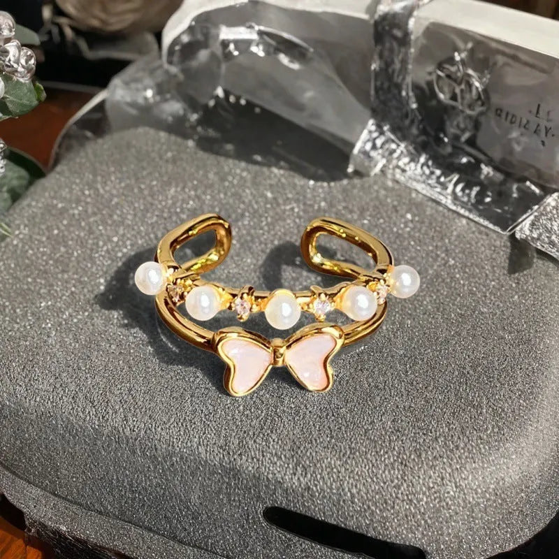 Adjustable copper ring with New Chinese style gourd, flower, and bow design in a vintage oil drip pattern.