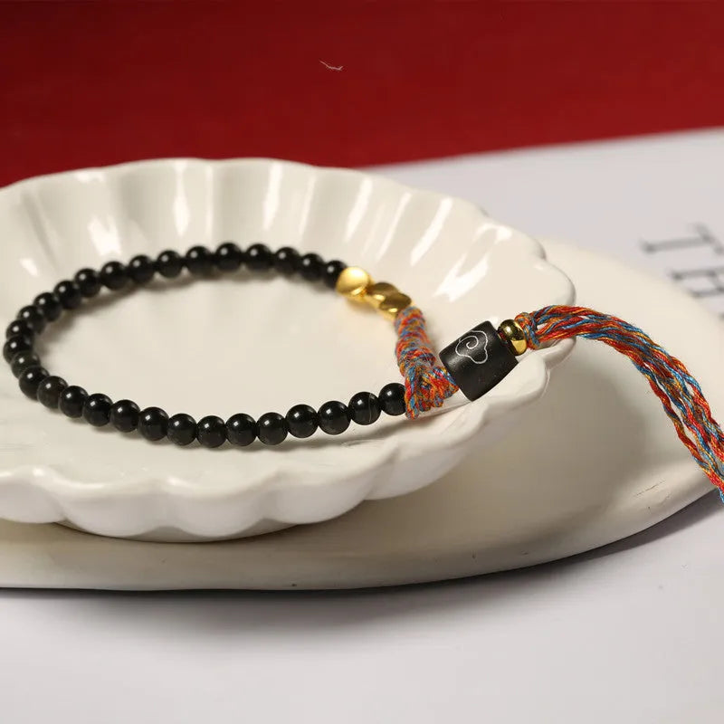 Obsidian coloured hand-woven carrying strap bracelet with 4mm width.