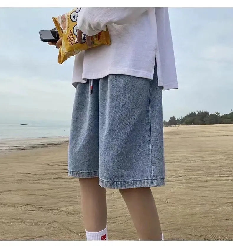 Men's loose straight casual cotton denim shorts in dark blue, front view