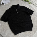 Man's grey twisted knit cotton style short sleeve T-shirt on a hanger
