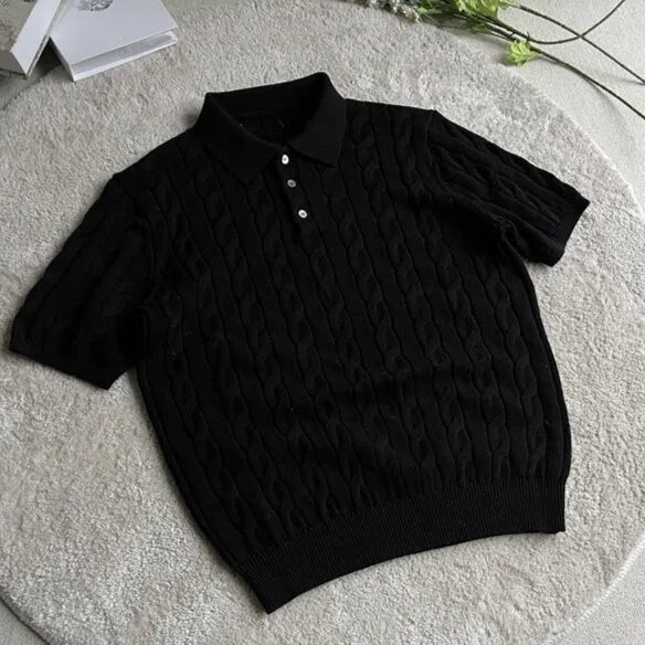 Man's grey twisted knit cotton style short sleeve T-shirt on a hanger